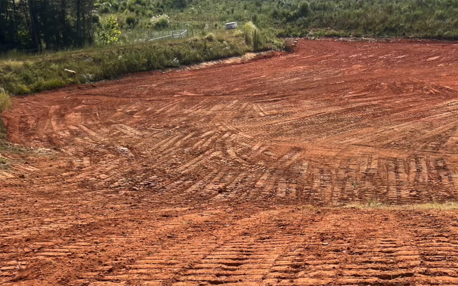 Heavy equipment compacting soil during site development